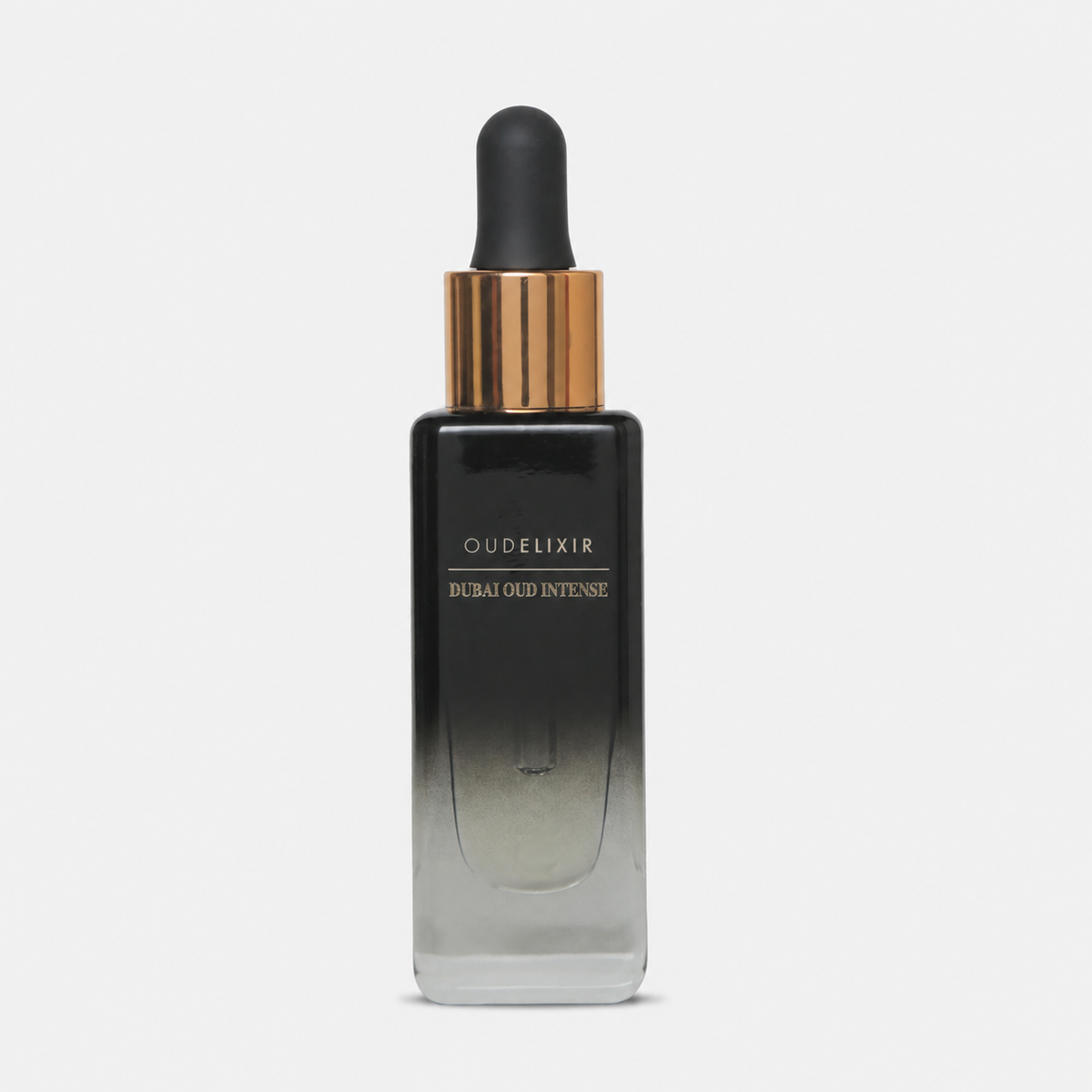 A luxury skincare dropper bottle from the brand Oudelixir, featuring a black-to-clear gradient glass bottle with a metallic gold collar and a matte black dropper cap, set against a clean white background.